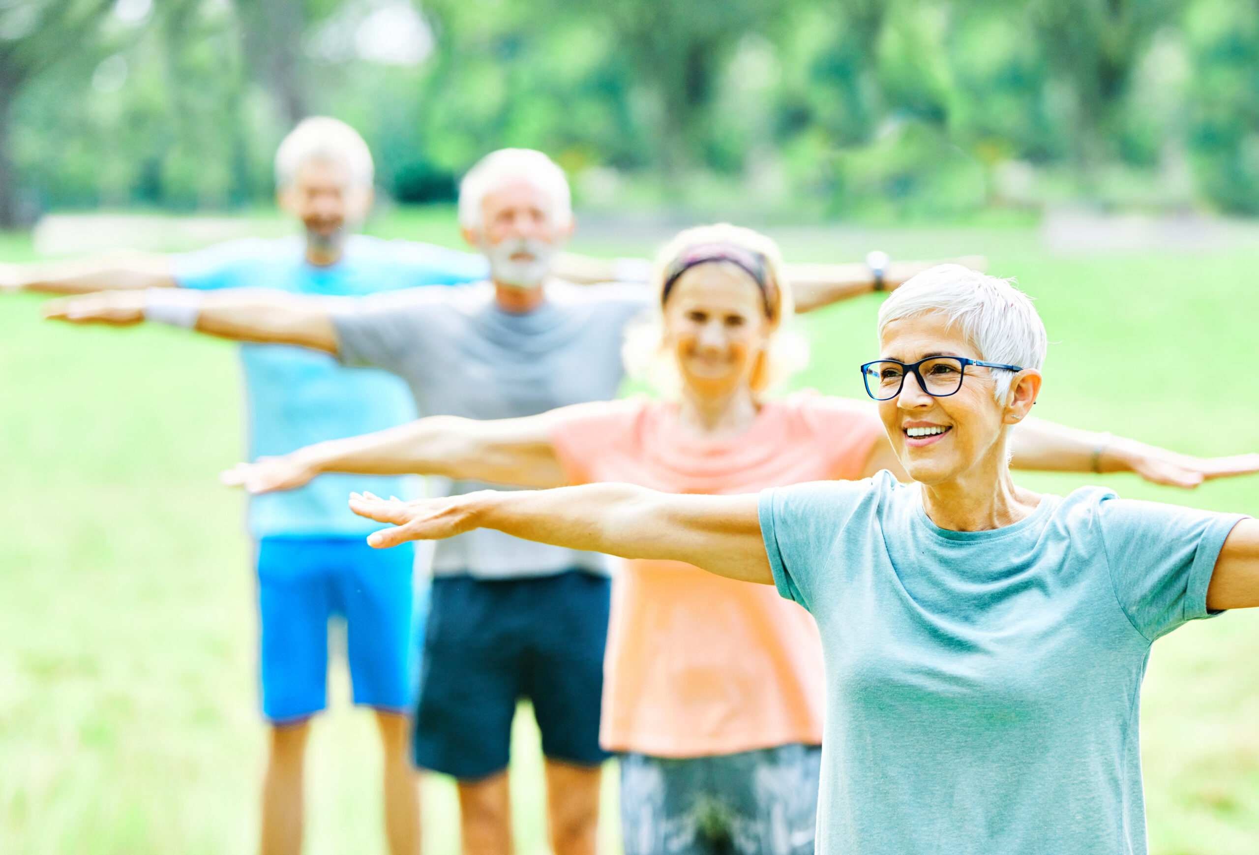 Seniors stretching outdoors